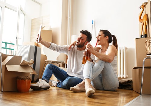 couple taking a selfie in new home